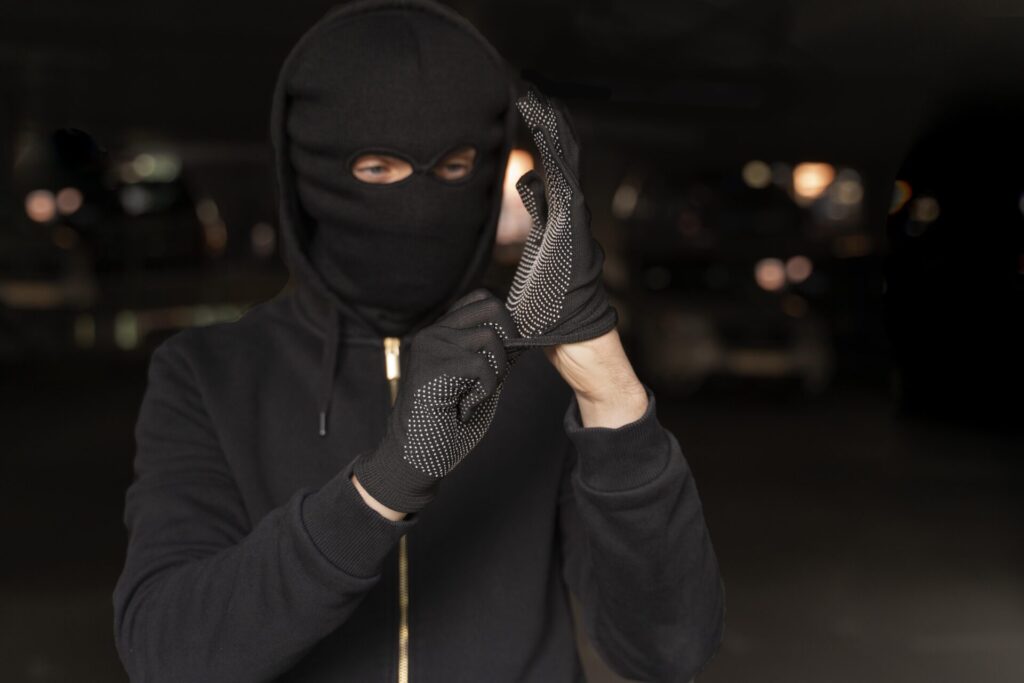 close up man trying break into car